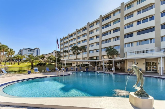 view of swimming pool with a patio area and pool water feature