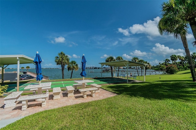 view of home's community featuring a water view and a yard