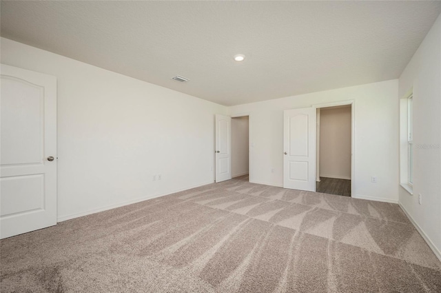 unfurnished bedroom with carpet floors