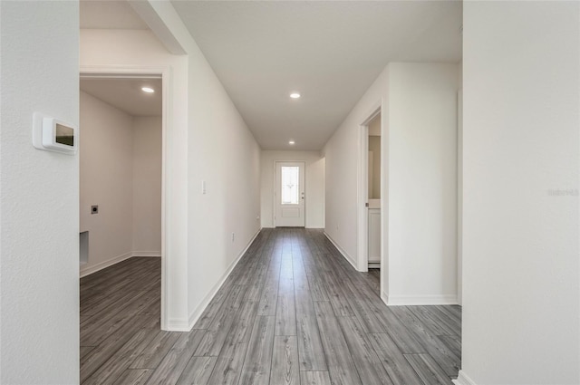 corridor with light hardwood / wood-style flooring