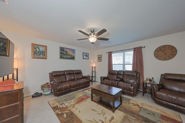 tiled living room with ceiling fan