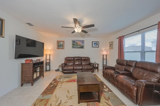 living room featuring ceiling fan and light tile patterned floors