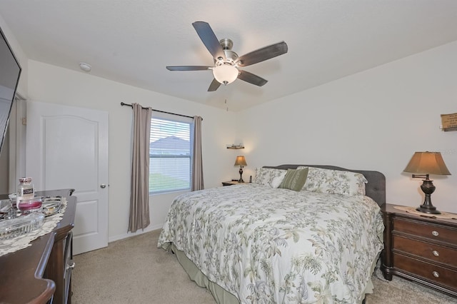 bedroom with light colored carpet and ceiling fan