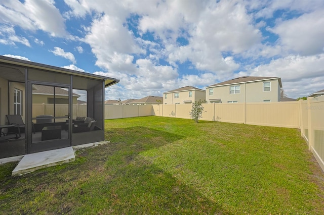 view of yard with a sunroom