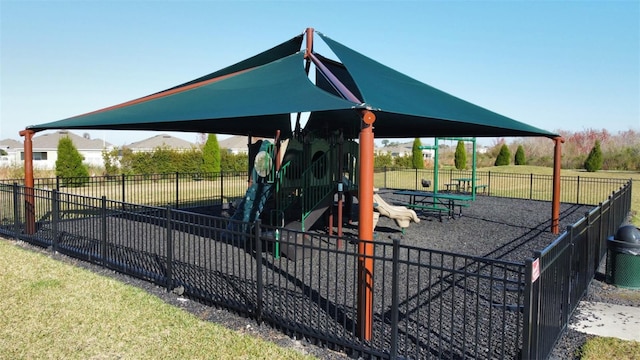 view of playground with a lawn