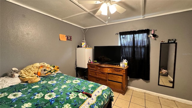 bedroom featuring light tile patterned floors, ceiling fan, and baseboards