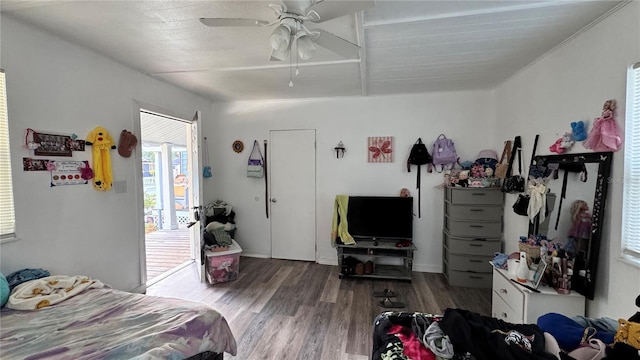bedroom with a ceiling fan and wood finished floors