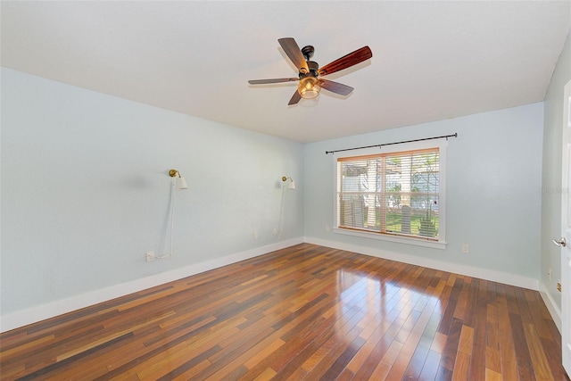 unfurnished room featuring ceiling fan and dark wood-type flooring