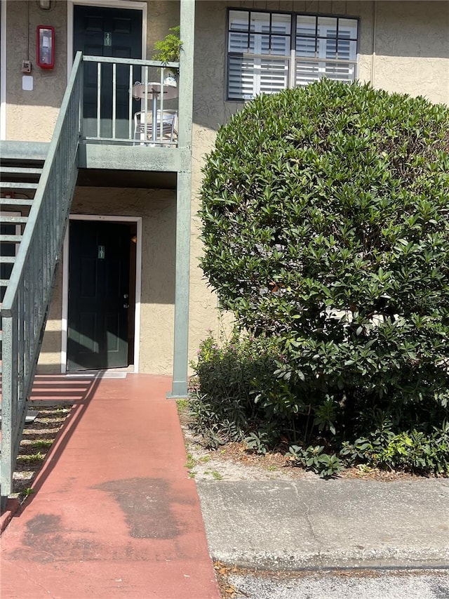 entrance to property with a balcony