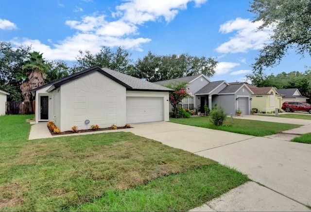 single story home featuring a front lawn and a garage