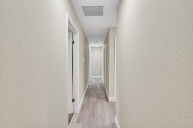 corridor featuring light hardwood / wood-style flooring