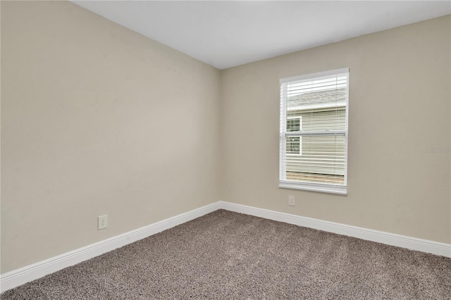 unfurnished room with carpet flooring