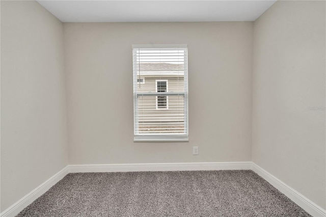 unfurnished room featuring carpet flooring