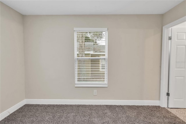 unfurnished room with light colored carpet