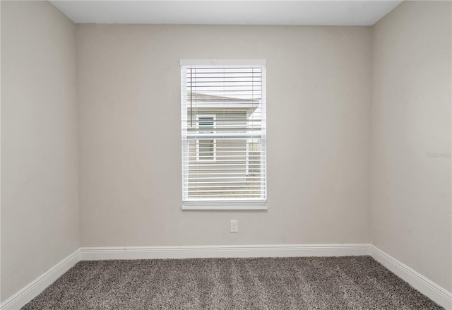 unfurnished room with carpet floors