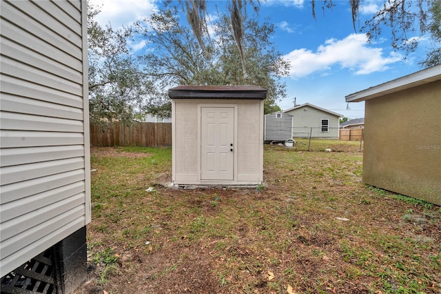 view of shed / structure featuring a yard