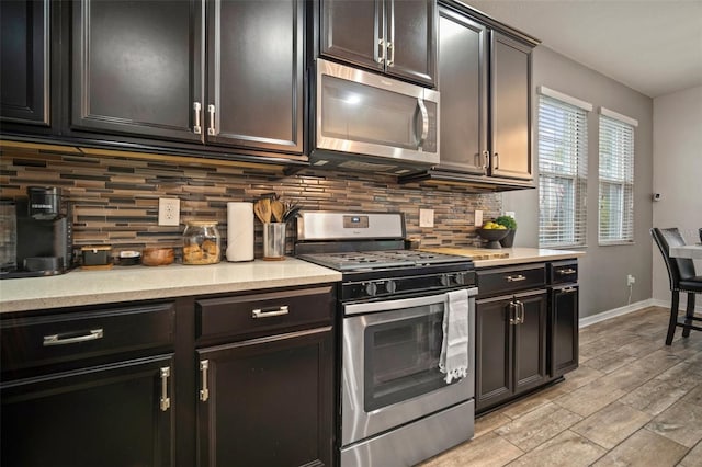 kitchen with backsplash and stainless steel appliances