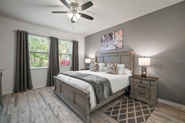 bedroom featuring light wood-type flooring and ceiling fan