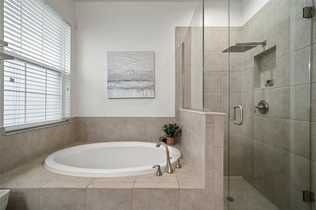 bathroom with shower with separate bathtub