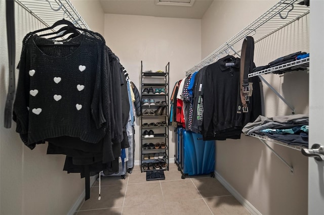 spacious closet featuring tile patterned floors