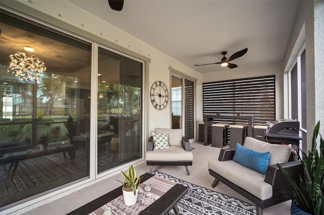 sunroom with ceiling fan