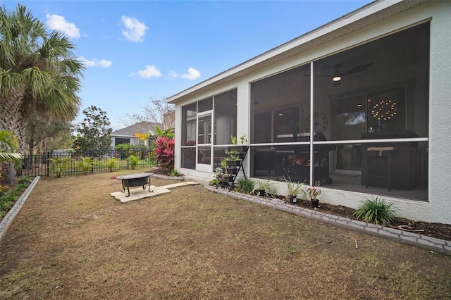 view of yard with a sunroom