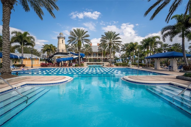 view of swimming pool featuring a patio area and a water slide