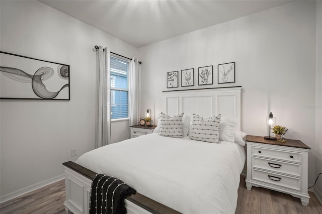 bedroom with wood-type flooring