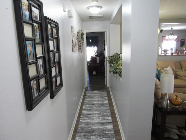 hall with dark hardwood / wood-style floors