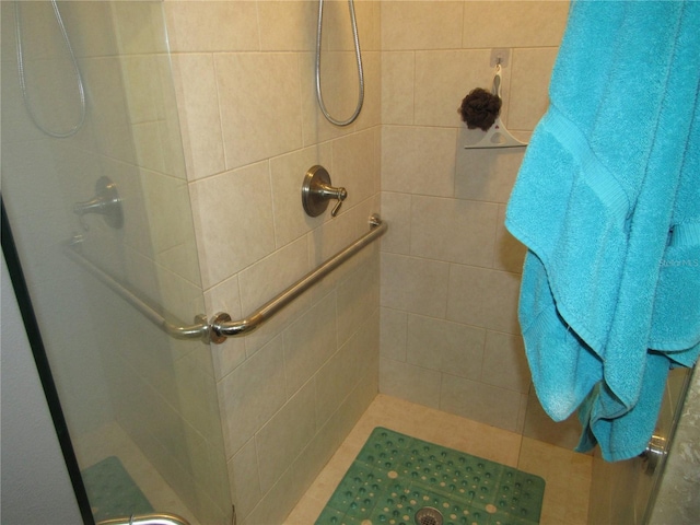 bathroom with tiled shower