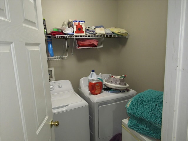 washroom featuring washing machine and dryer