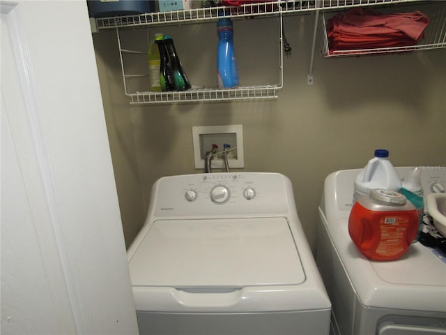 washroom with washer and dryer