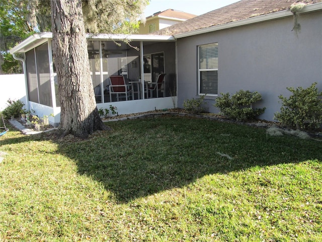 view of yard featuring a sunroom