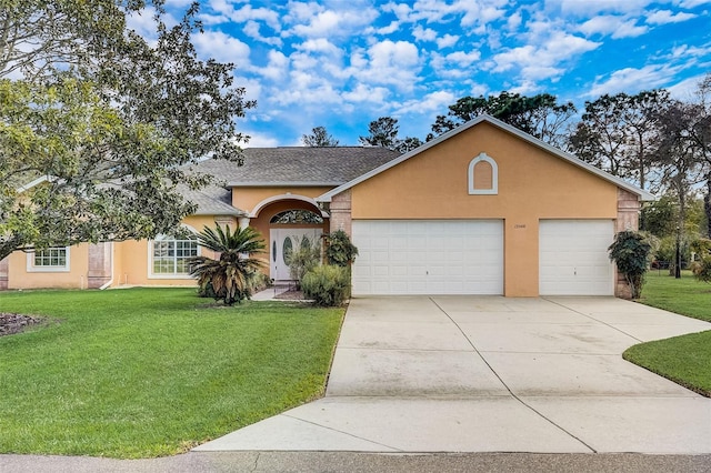 ranch-style home featuring a front lawn and a garage