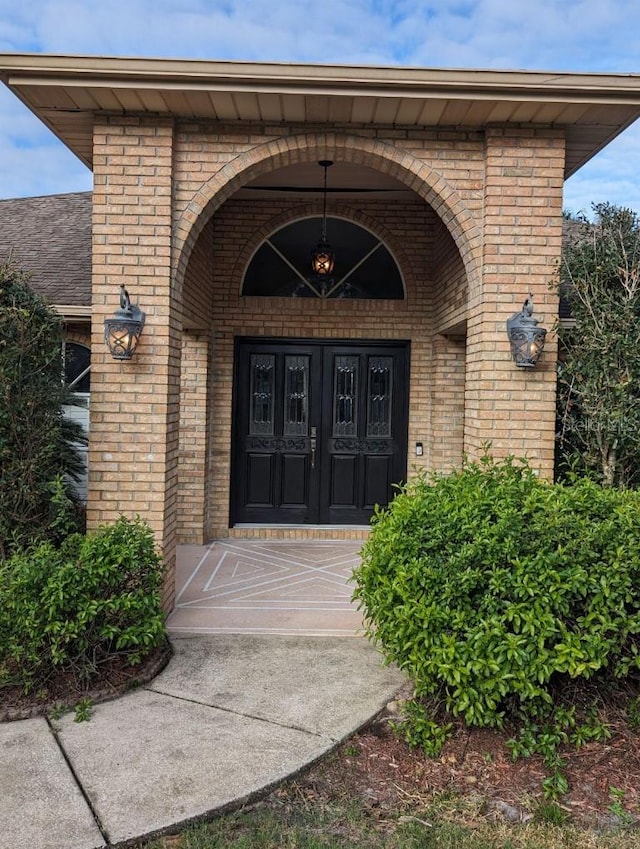 doorway to property featuring covered porch