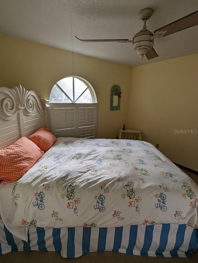 unfurnished bedroom featuring carpet flooring and ceiling fan