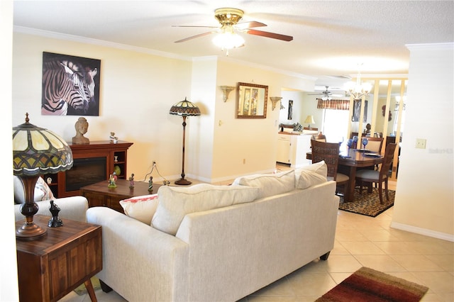 living room with light tile flooring, crown molding, a textured ceiling, and ceiling fan with notable chandelier