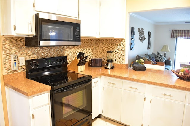 kitchen with tasteful backsplash, ornamental molding, black electric range, and white cabinetry