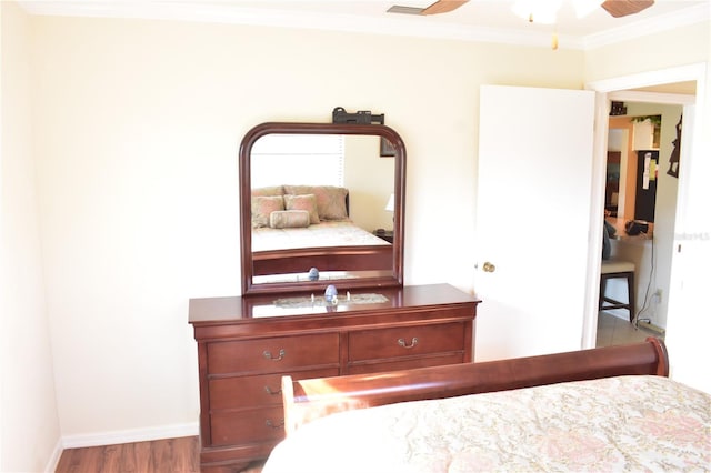 unfurnished bedroom with crown molding, ceiling fan, and light hardwood / wood-style flooring