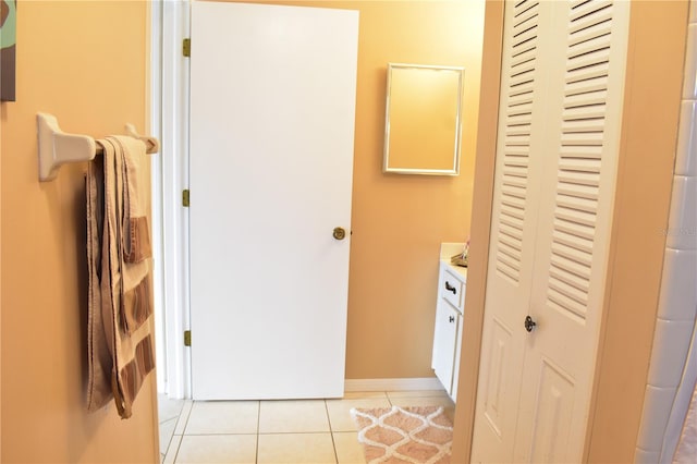 bathroom featuring tile flooring and vanity