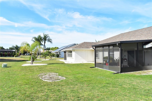 view of yard featuring a sunroom