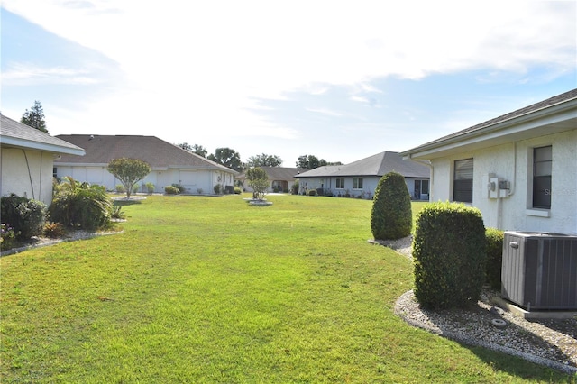 view of yard featuring central AC