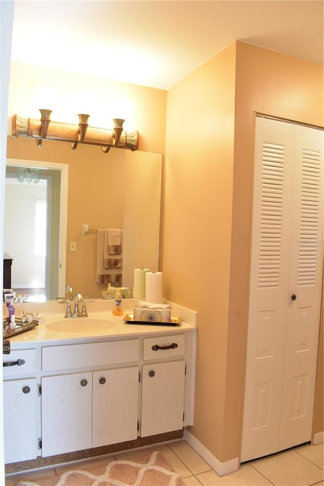 bathroom featuring tile floors and vanity