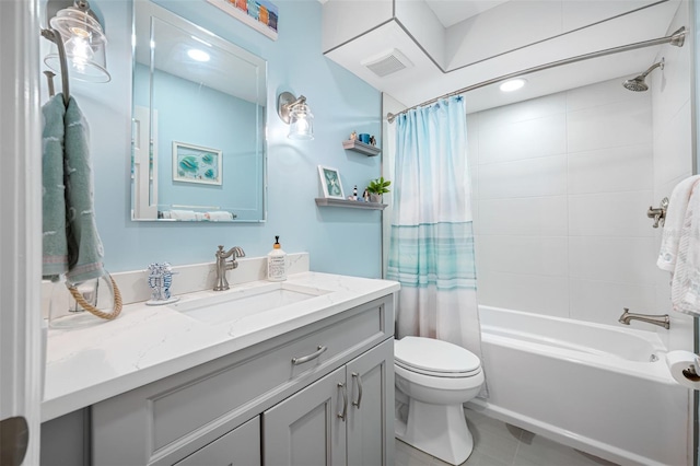 full bathroom featuring shower / bath combo with shower curtain, toilet, vanity, and tile flooring