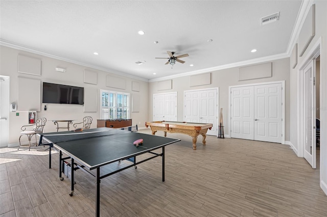 recreation room with pool table, light hardwood / wood-style floors, ceiling fan, and ornamental molding