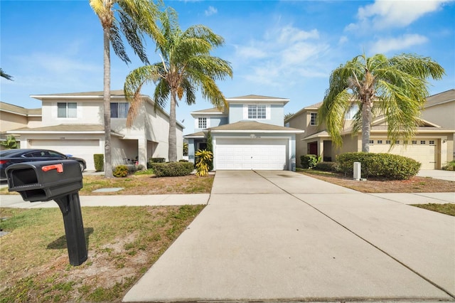 traditional-style house with a garage, driveway, and a residential view