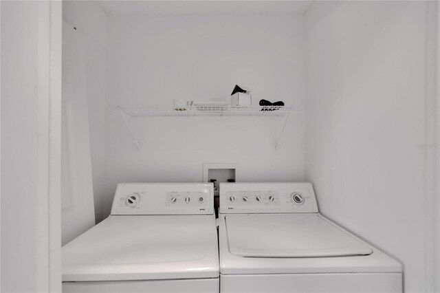 laundry room featuring separate washer and dryer