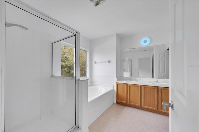 bathroom featuring separate shower and tub, tile patterned flooring, and vanity