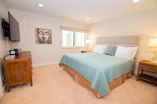 bedroom with light colored carpet