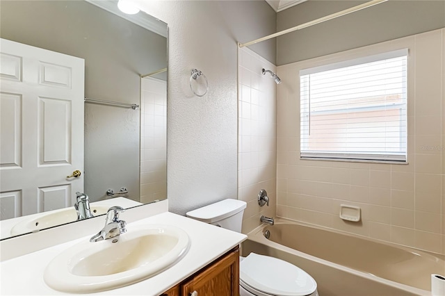 full bathroom with vanity, toilet, and tiled shower / bath